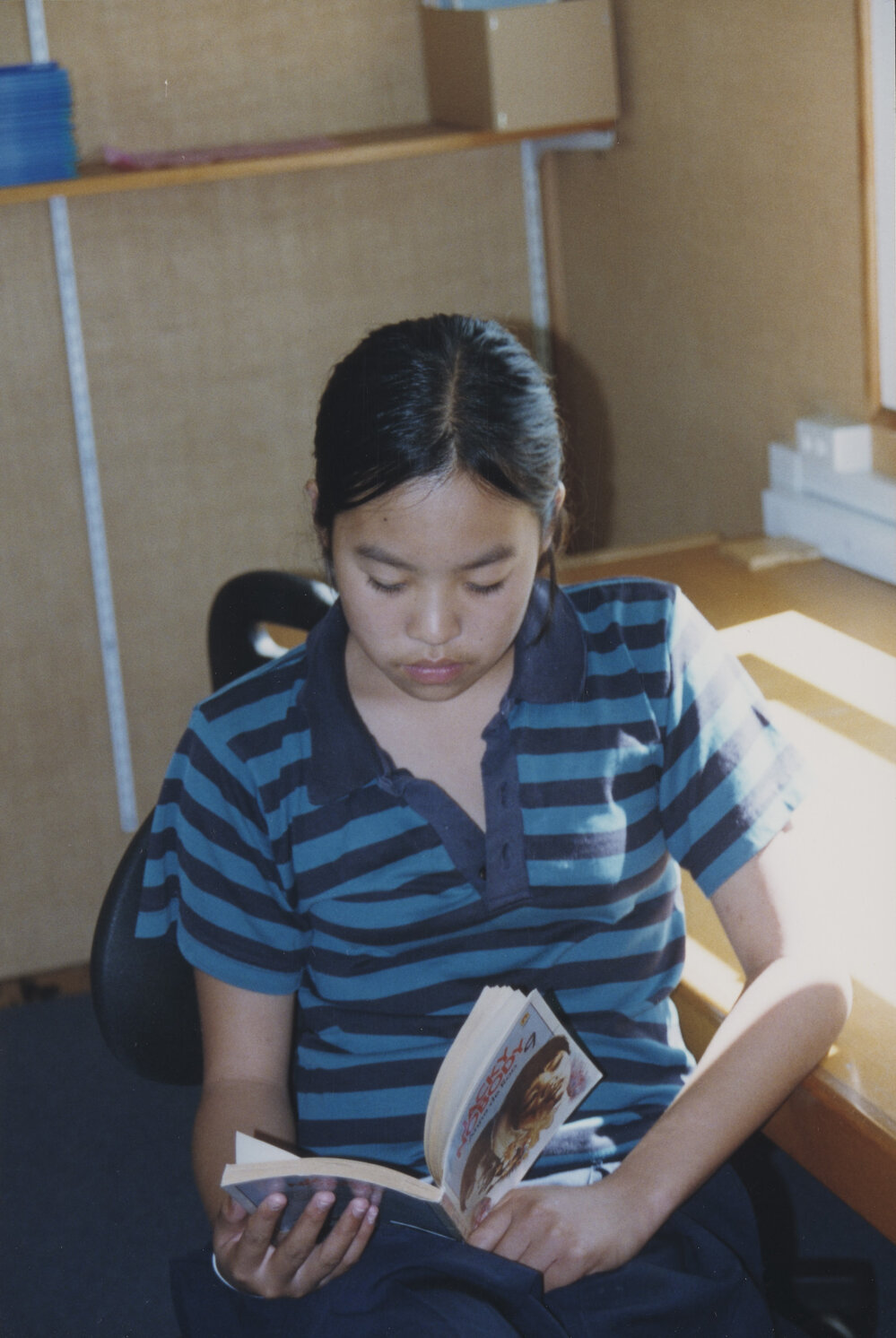 Student reading in classroom