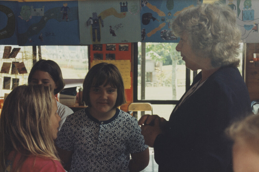 Students with teacher in classroom