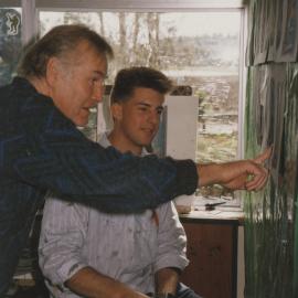 Student and teacher in art classroom