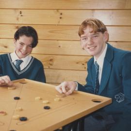 Students playing Carrom