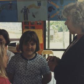 Students with teacher in classroom