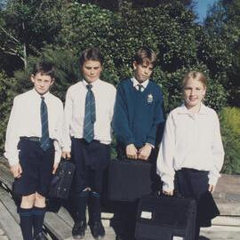 Students holding laptops