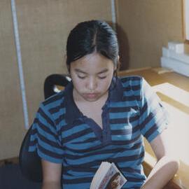 Student reading in classroom